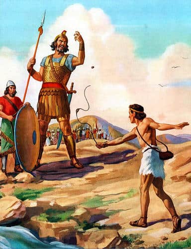 David slinging a stone at the armored giant Goliath