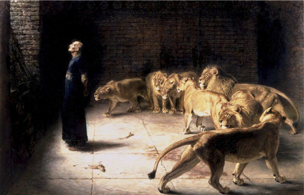 Daniel’s Answer to the King by Briton Rivière: Daniel standing calmly with his back to a den of lions